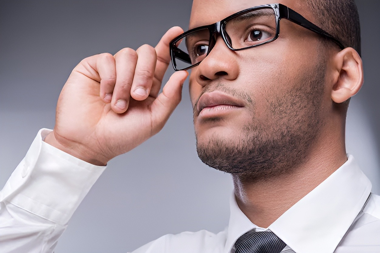 IVision Optical Ethiopia | confident businessman low angle view thoughtful young african man shirt tie 425904 28194 1